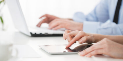 Close up of group of people working at the office